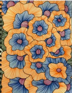 an orange and blue flower pattern on a notebook