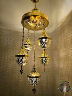 a golden chandelier hanging from the ceiling