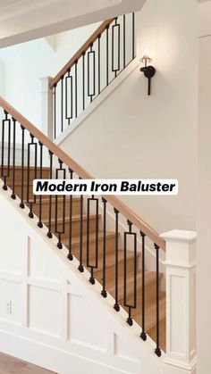 the modern iron baluster is installed in an empty room with wood floors and white walls