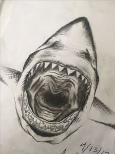 a drawing of a shark with its mouth open