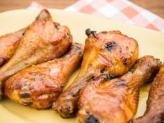 several pieces of chicken on a yellow plate