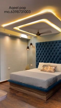 the bed is made up and ready to be used as a headboard in this modern bedroom