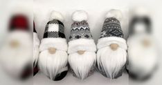 several knitted gnomes are lined up in a row with white hair and beards