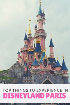 a castle with the words top things to experience in disneyland paris on it's side