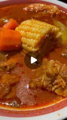 a bowl filled with meat and vegetables on top of a table