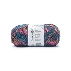 a ball of yarn that is multicolored and has a white tag on it