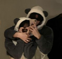 a person in a panda costume taking a selfie