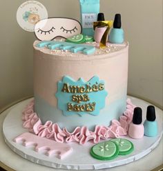 a birthday cake decorated with cosmetics and eyeliners