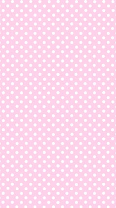 a pink background with white polka dots