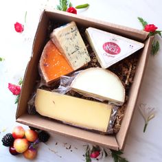 a box filled with different types of cheese