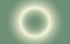 a white circle is shown in the middle of a green background with light coming from it