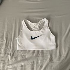 White Nike Sports Bra. Brand New With Tags! Little Padding But Good Support. Size Medium. Smoke Free, Dog Friendly Home. Nike Sports Bra And Sweatpants Set, Nike Gym Wear, White Sports Bra With Built-in Padding, Nike Sports Bra With Built-in Padding, White Activewear With Built-in Padding For Gym, White Sports Bra With Built-in Padding For Workout, Nike Sports Bra With Go-dry Technology, Nike Athletic Fit Sports Bra With Go-dry Technology, Nike Athletic Fit Sports Bra With Go-dry