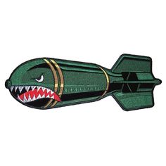 an image of a shark with teeth on it's face and mouth, in the shape of a rocket ship