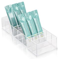 four toothbrushes in a holder on a white background