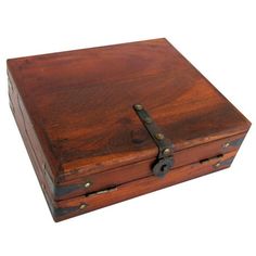 an old wooden box with metal handles