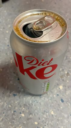 a can of diet coke sitting on top of a counter