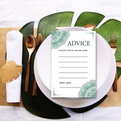 a place setting with white plates and silverware