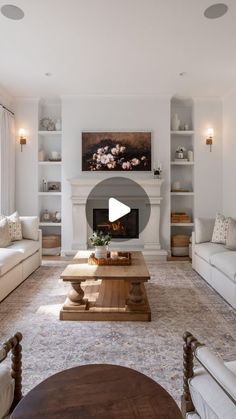 a living room filled with furniture and a fire place