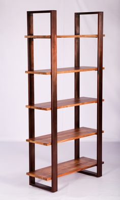 a wooden bookcase with three shelves on each side and one shelf in the middle