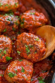 meatballs with sauce and parsley in a skillet, ready to be eaten