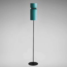 a blue floor lamp on a black stand