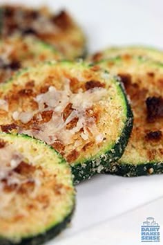 stuffed zucchini boats on a white plate