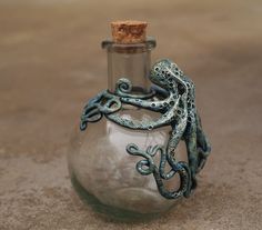 a glass bottle with an octopus in it