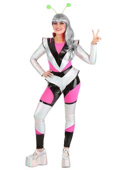 a woman in a pink and white costume posing for the camera with her hands up