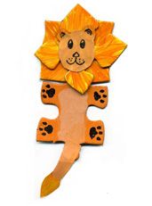 a paper cut out of a lion with paws on it's back