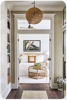 an open door leading to a bedroom with a bed