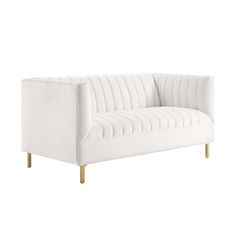 a white couch with gold legs on a white background