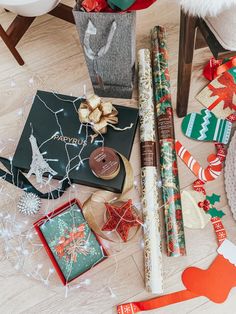 christmas wrappings and presents on the floor