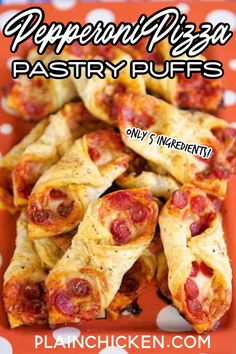 pepperoni pizza pastry puffs on an orange and white polka dot plate with text overlay