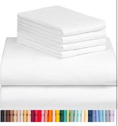 white sheets and pillowcases are stacked on top of each other in different colors