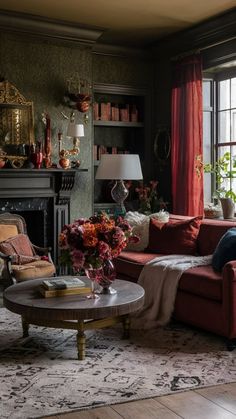 a living room filled with furniture and a fire place in front of a large window