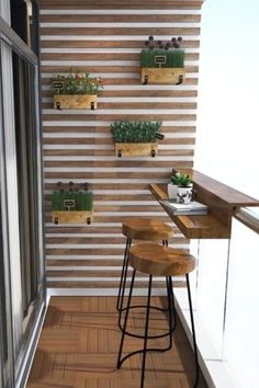 two stools are on the balcony next to some plants