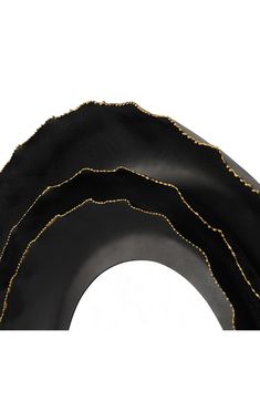 three black tires with gold threading on them