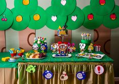 the table is set up for an animal themed birthday party