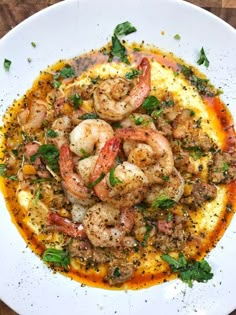 shrimp and grits in tomato sauce on top of polenta with parsley garnish