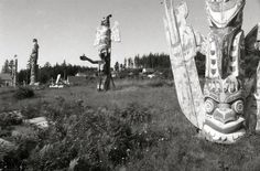 an old black and white photo of totems in the grass