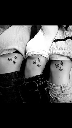 two women with butterfly tattoos on their stomachs, one is showing the other side