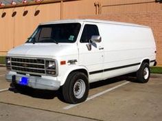 a white van parked in a parking lot