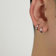 a man with ear piercings on his ears