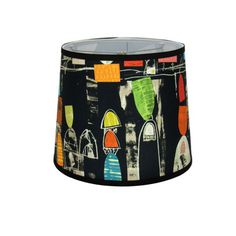 a black lamp shade with colorful designs on it