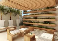 a living room filled with lots of wooden furniture and plants on the wall next to it