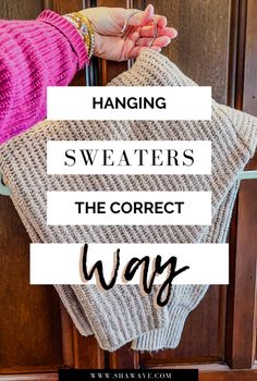 a woman's hand holding a sweater on the door handle with text overlay saying hanging sweaters the correct way