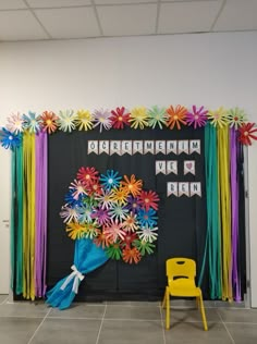 a classroom decorated with paper flowers and streamers