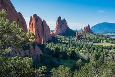 the garden of the gods is surrounded by towering rock formations in colorado's garden of the gods