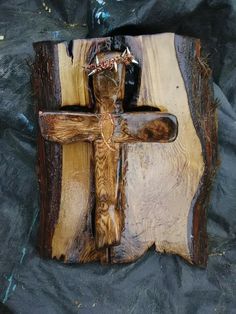 a cross made out of wood sitting on top of a table