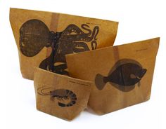 three brown paper bags with fish and sea creatures on them, one is folded to the side